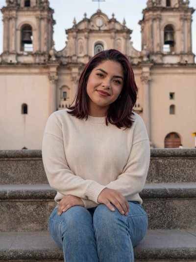Paola, 25, Honduran single from Comayagua in cream sweater at colonial cathedral - verified dating profile