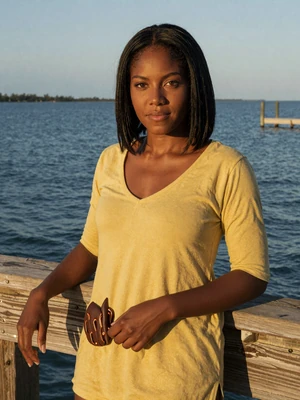 Destiny, 28, Bahamian woman from Marsh Harbour by the ocean dock at golden hour - Latin 312 verified profile