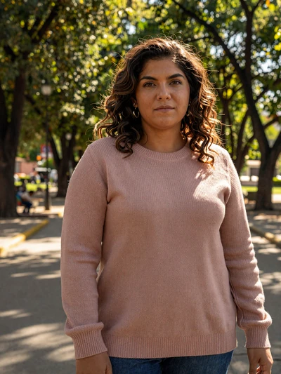 Ileana, 30, Salvadoran woman from Santa Tecla in rose sweater at a tree-lined park - Latin 312 verified profile