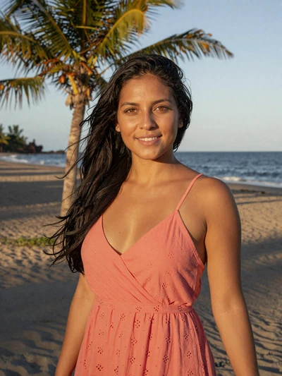 Indira, 29, Nicaraguan woman from Chinandega in coral sundress near tropical Pacific beach - Latin 312 verified profile