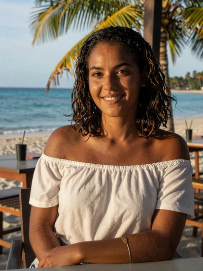 Léonie, 25, French Guianese single from Remire-Montjoly at beachside cafe with turquoise ocean - verified dating profile