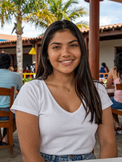 Gabriela, 24, Bolivian single from Santa Cruz with bright smile at tropical restaurant - verified dating profile