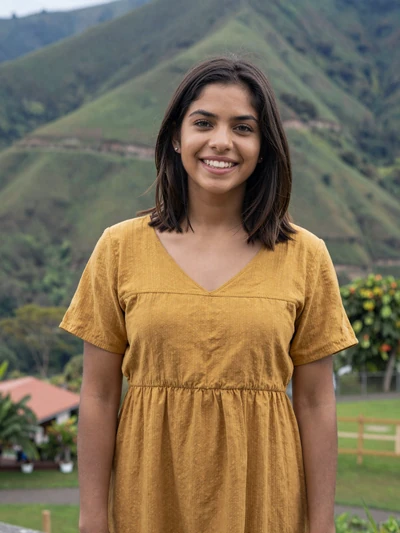 Sofía, 25, Costa Rican single from Cartago in yellow dress at scenic mountain overlook - verified dating profile
